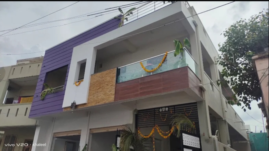 Purple and white exterior house painting project in Kurnool