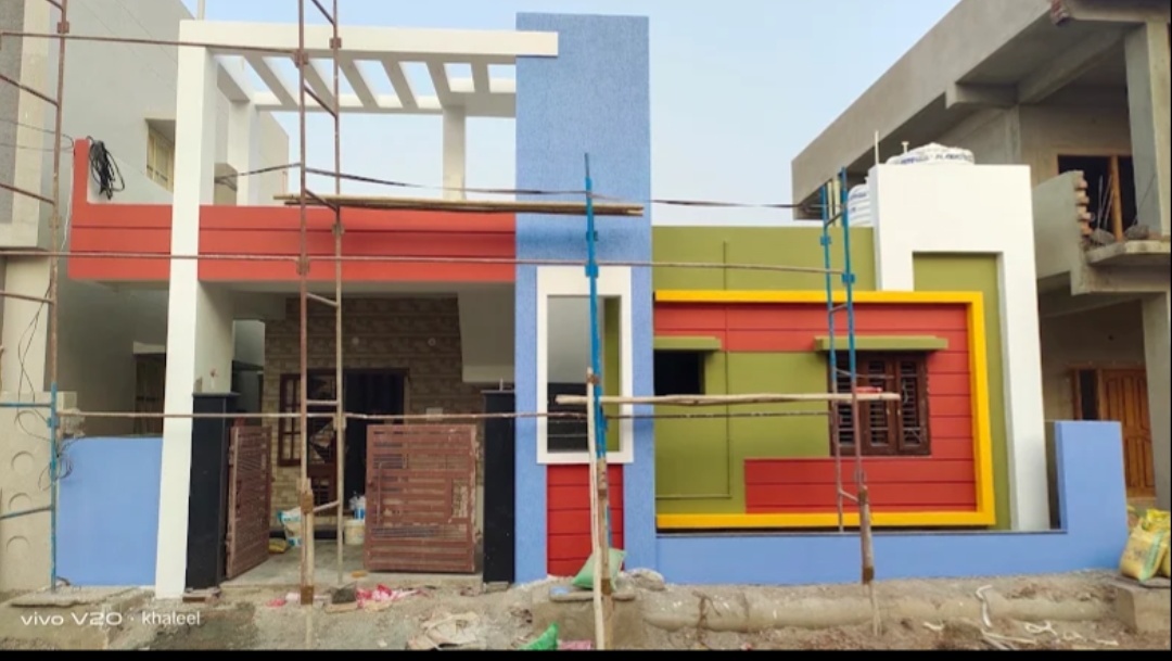 Colourful modern house exterior with blue, red and green accents
